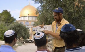 On a tour of the Temple Mount, Yehuda Glick shows religious Jews a diagram of the Jewish temple, which once stood where the golden Dome of the Rock stands today on Sepetember 17, 2013 in Jerusalem Israel. (Christa Case Bryant/Christian Science Monitor via Getty Images)