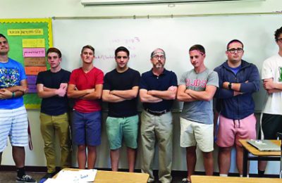 Jerry Rotenberg, fifth from left, poses with the 2015 DJDS varsity soccer team prior to a game.