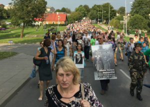 Relatives of Holocaust victims walk in a memorial march in the Lithuanian town of Moletai, Aug. 29, 2016.