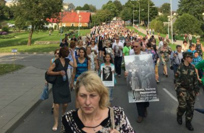 Relatives of Holocaust victims walk in a memorial march in the Lithuanian town of Moletai, Aug. 29, 2016.