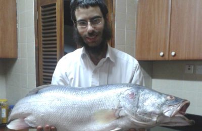 Rabbi Shmuel Notik holding a Nile perch at his home in Nairobi in 2015.