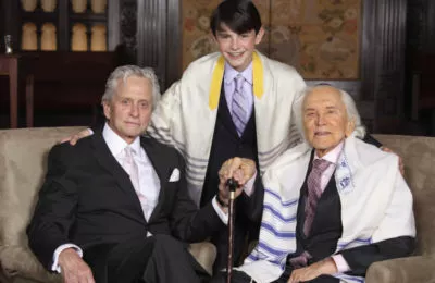 Kirk Douglas, right, with son Michael and grandson Dylan at Dylan’s Bar Mitzvah, May, 2014. (Infinity Kornfeld Studios)