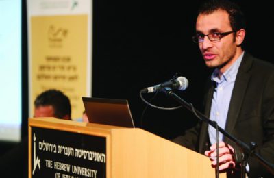 Sirwan Kajjo speaking at the event at Hebrew University in Jerusalem, Jan. 17. (Hillel Maeir/TPS)
