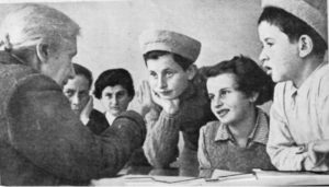 Hadassah founder Henrietta Szold meeting with Tehran Children in Israel, February, 1943. (Jewish Agency for Israel)