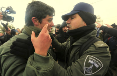 Police and protesters face off during the forced evacuation of Amona in the West Bank, Feb. 1. (Ashernet)
