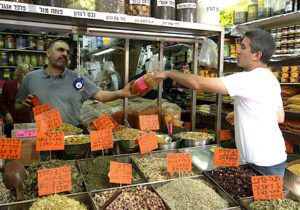Chef Michael Solomonov sampling the wonders of the Levinsky Market in Tel Aviv.