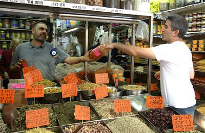 Chef Michael Solomonov sampling the wonders of the Levinsky Market in Tel Aviv.