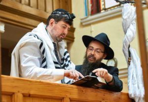 Csanad Szegedi, left, with Rabbi Boruch Oberlander. (AJH Films)