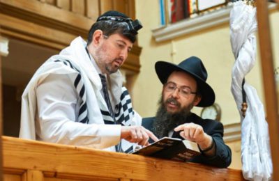 Csanad Szegedi, left, with Rabbi Boruch Oberlander. (AJH Films)