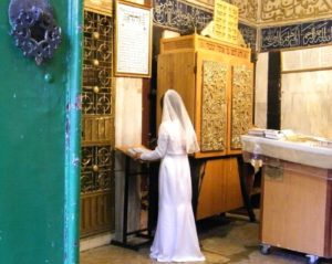 A Jewish bride prays at the gravesite of the Matriarch Sarah, in the Tomb of the Patriarchs in Hebron. (Wikipedia)
