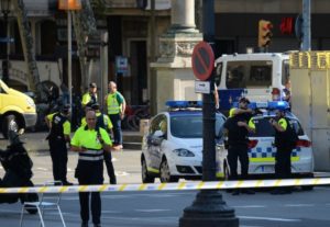 Medical staff members and policemen standing in a cordoned off area after a van plowed into the crowd on the Rambla in Barcelona, Aug. 17, 2017. (Josep Lago/AFP/Getty)
