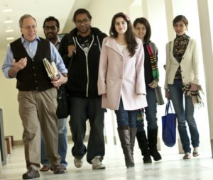 Gary Wasserman, left, with students on the Georgetown campus in Qatar, 2012.