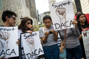 Three 'Dreamers' originally from Ecuador gather for a protest in Grand Army Plaza in Manhattan, Sept. 5. (Drew Angerer/Getty)