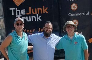 Ben Davis, Rabbi Avraham Mintz and Quincy Carpenter pose before Davis and Carpenter take off for Houston in the Junk Trunk.