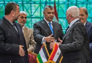 L-r: Hamas' Saleh al-Aruri and Yahya Sinwar, Khaled Fawzi, head of the Egyptian Intelligence services, and Fatah’s Azzam al-Ahmad and Rawhi Fattouh following the signing of a reconciliation deal between Fatah and Hamas in Cairo on Oct. 12, 2017. (Khaled Desouki/AFP/Getty)