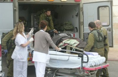 A wounded Syrian refugee arrives for treatment at Ziv Medical Center in Safed.