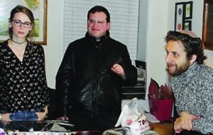 Rabbi Avram Mlotek, right, at his Base Hillel home in New York City.