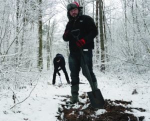 Jonny Daniels, foreground, and Robert Skrupa, a From the Depths volunteer, digging up fragments of Jewish headstones in eastern Poland, 2015.