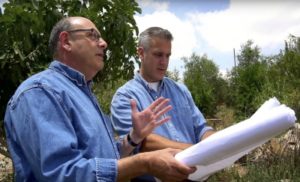 Alan Cohl, left, and Noam Cohen surveying the site of their distillery.