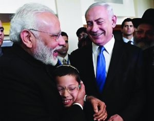 Moshe Holtzberg is embraced by Indian Prime Minister Narendra Modi during his visit to Israel.