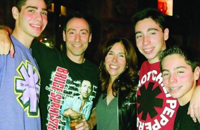 Bruce and Irene Steinberg, surrounded by sons William, Zachary, and Matthew.