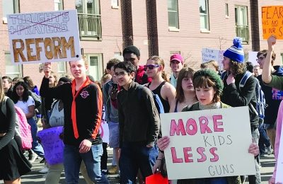 Students from East High School join the national student walkout, March 14.