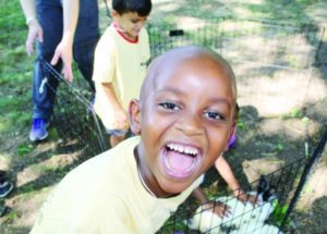 A happy camper at the St. Louis day camp run by the JCRC.