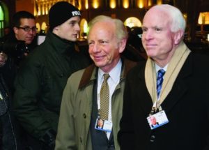 Sen. John McCain, right, with Sen. Joseph Lieberman in Munich in 2014. (Jörg Koch/Getty)