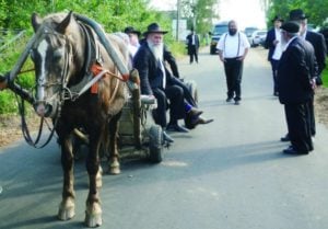 Rabbi Jehoshua Raskin shares a ride with other visitors to Lyubavichi, Russia, Aug. 26.