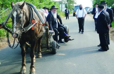 Rabbi Jehoshua Raskin shares a ride with other visitors to Lyubavichi, Russia, Aug. 26.