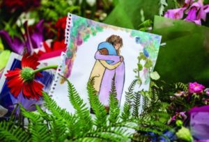 A picture among flowers and tributes near Al Noor mosque on March 18, 2019 in Christchurch, New Zealand. (Carl Court/Getty)