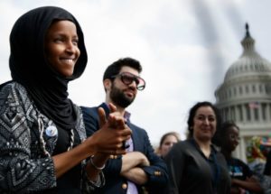 Rep. Ilhan Omar, with her spokesman, Jeremy Slevin, March 15, 2019. (Tom Brenner/Getty)