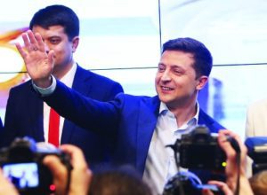 Volodymyr Zelensky waves to supporters at his campaign headquarters in Kiev, Ukraine, April 21, 2019. (Xinhua/Sergey/Getty)