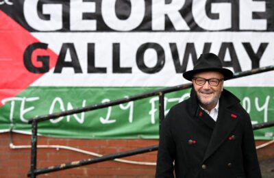 MP for Rochdale George Galloway, poses for a photograph outside his campaign headquarters in northern England on March 1, 2024. (Oli Scarff/AFP via Getty Images)