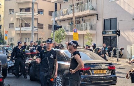 Police congregate near the site of a drone attack in Tel Aviv on July 19, 2024. (Ben Sales)