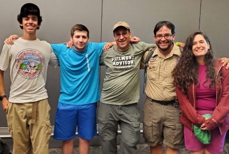 Ariel Yaron (left), Moshe Grimaldi (second from left), Evan Gilder (center), Joel Shuart (second from right), Rachel Travis (right) were among five members of a Jewish contingent of Boy Scouts who participated in a CPR rescue aboard a flight to New York on July 11, 2024. (Courtesy)