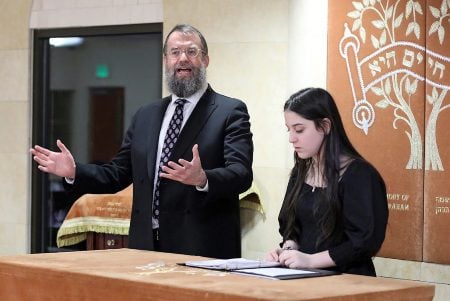 Rabbi Avraham Mintz welcomes guests at the March 4, 2023 Havdalah Bat Mitzvah of Eliana Heyman at the Chabad Jewish Center of South Metro Denver.