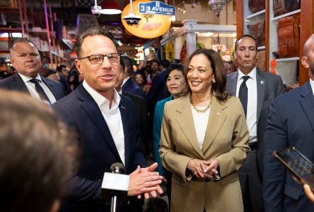 Vice President Kamala Harris, right, and Pennsylvania Gov. Josh Shapiro, left, at the Reading Ter- minal Market in Philadelphia on a Harris campaign stop, July 13. (Ryan Collerd/AFP/Getty Images)