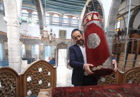 Syrian Rabbi Yousef Hamra and accompanying Jews visit the Frenc and Raki churches, the Maimonides Jewish School and the Jobar Synagogue, which was largely destroyed during the civil war, in the historic districts of Damascus, Syria on February 18, 2025. (Bakr Al Kasem/Anadolu via Getty Images)
