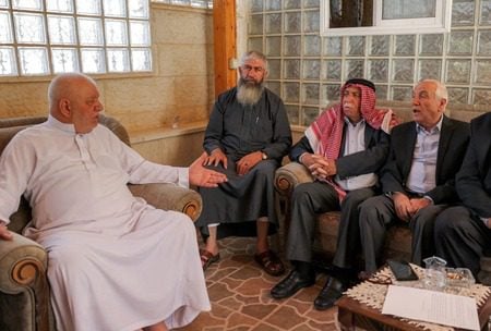 Aref al-Jaabari, right, former governor of Hebron and head of the Jaabari family in the area, attends a meeting with elders of the Jaabari family, July 6, 2025. (Hazem Bader/AFP/Getty Images)