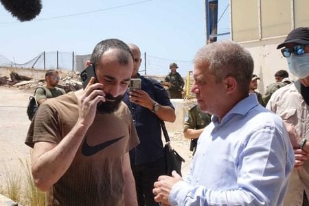 Salah Abu-Hussein, left, with Brig.-Gen. (Res.) Gal Hirsch, Coordinator for the Hostages and the Missing, Aug. 21, 2025. (Michael Dimenstein/GPO)