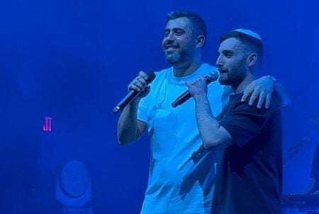 Matan Angrest, right, joins Ishay Ribo on stage.