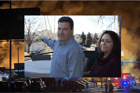 Marty and Shira Zimmerman survey the devastation of the fire from the front porch of their home. The fire was just behind the houses across the street from them. (Steve Mark)