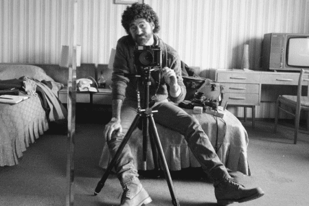 Photographer Edward Serotta takes a self-portrait in a hotel room during his efforts to document Romania in the 1980s. (Courtesy Serotta)