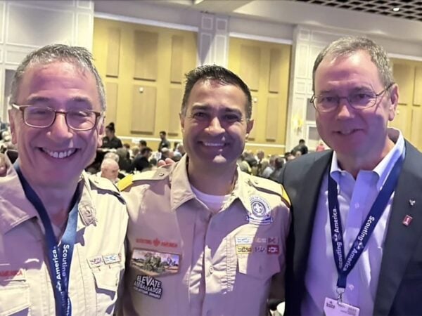 L-r: Ricky Mason, incoming natinal executive board chair of Scouting America; national commissioner Debang Desai; and outgoing chair Brad Tilden.