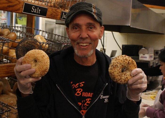 Moe’s Broadway Bagel General Manager Steve Pagnotta with the popular sesame and Italian varieties of bagels. (Steve Mark)