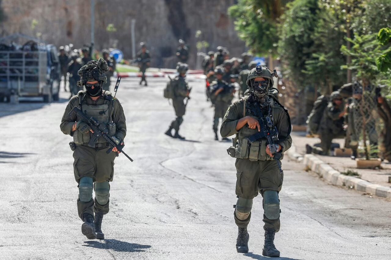 Israel Defense Forces remove an illegal outpost from the Palestinian village of Qusra, in which extremist settlers had cut off electricity and solar panels. Mike Huckabee, US ambassador to the US; Yisrael Ganz, head of the pro-West Bank settlement Yesha Council; and Yuli Novak, head of B’Tselem, which opposes all Jewish settlements on the West Bank; all condemned the outpost. (Zain Jaafar/AFP via Getty Images)